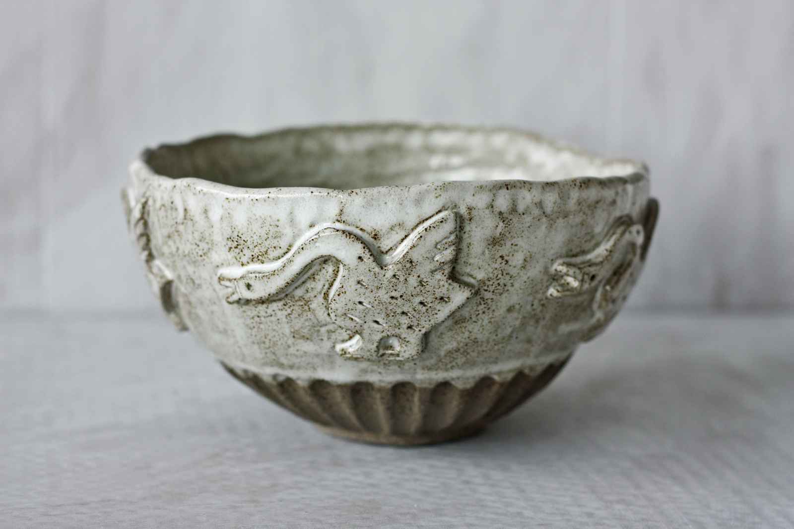 Textured ceramic vase in warm tones