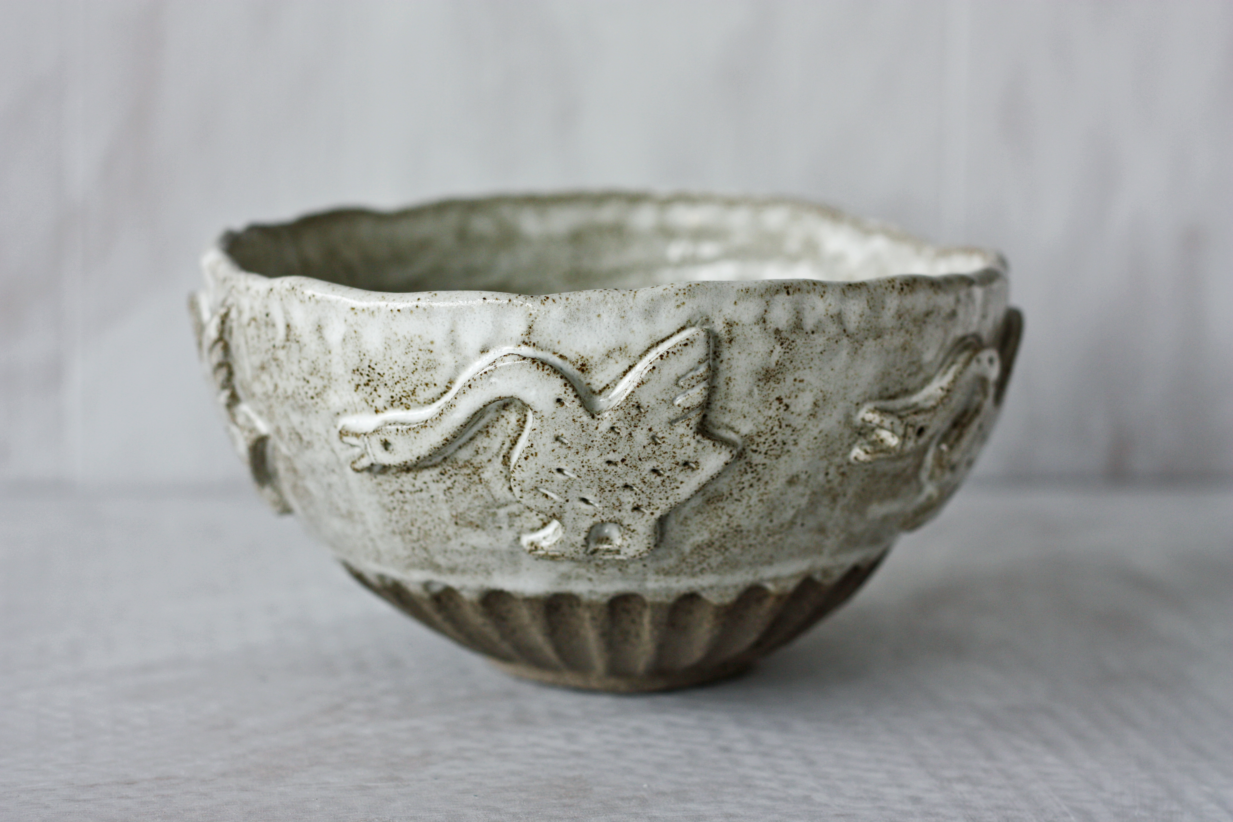 Textured ceramic vase in warm tones